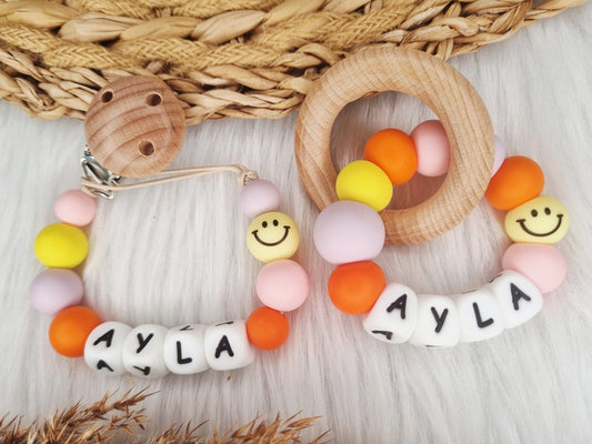 Bijtring met naam - Smiley - babypink, geel, lila, oranje