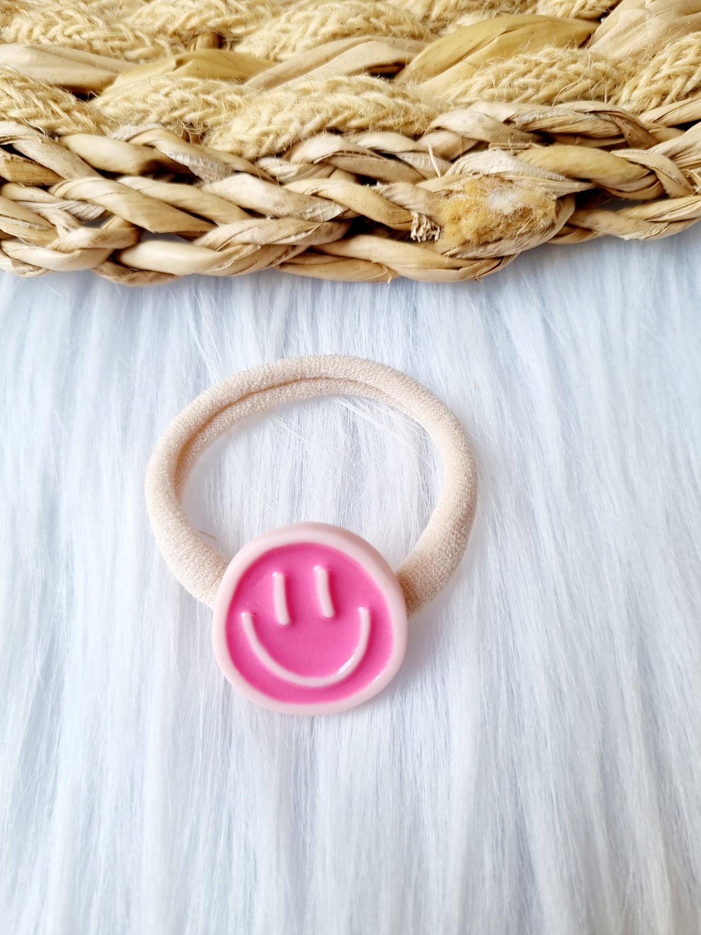 Haar elastiekje smiley roze