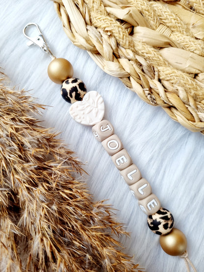 Sleutelhanger hart off white 
Panter, goud