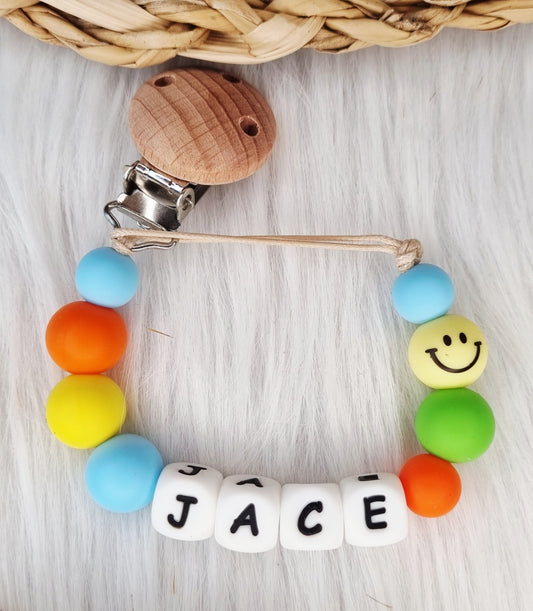 Speenkoord met naam - Smiley, babyblauw, oranje, geel, groen