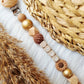 Speenkoord met naam  Daisy bruin, metallic goud, peach brons