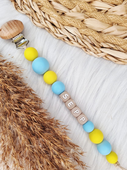 Speenkoord met naam - Colorblocking babyblauw,geel