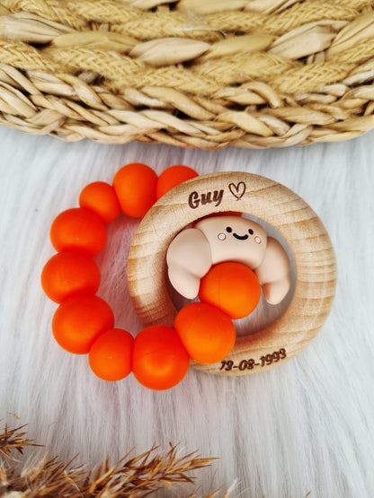 Bijtring gegraveerd jouw eigen ontwerp 
Croissant, oranje 