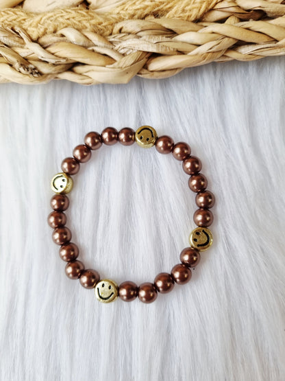Kinderarmband - Pearl smiley goud donkerbruin