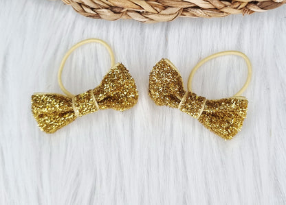 Haarelastiekje strik Glitter (lint)  2 stuks goud