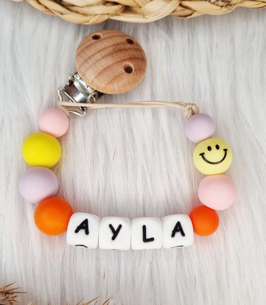 Speenkoord met naam - Smiley, babypink, geel, lila, oranje