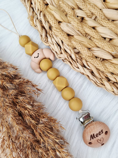 Newborn speenkoord gegraveerd met figuurtje (Jouw eigen ontwerp)
Croissant, camel